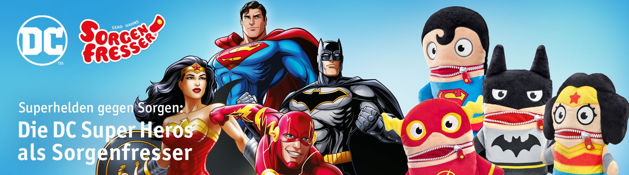 Werbebanner mit DC-Superhelden (Superman, Batman, Wonder Woman, Flash) und passenden Sorgenfresser-Plüschfiguren vor blauem Hintergrund.