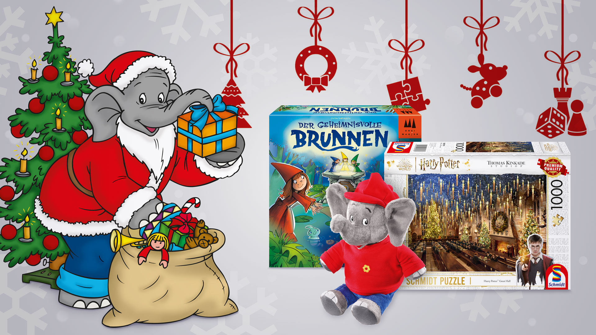 Benjamin Blümchen als Weihnachtsmann verkleidet mit verschieden Spielzeugen vor sich